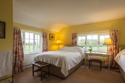 The large sunny family room has one double and one single bed and private adjacent shower and toilet. Down duvets and pillows, electric blankets.