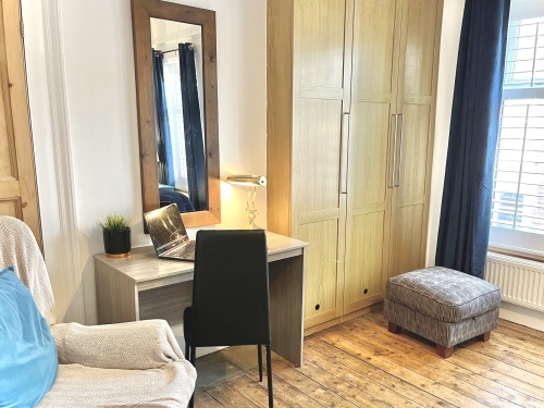 Bedroom 3   - Spacious bedroom with ample wardrobe space and dedicated desk workspace