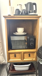 In each room: Microwave, plates, bowls, cutlery, tea, coffee, sugar, biscuits, kettle, mugs, drinking glasses