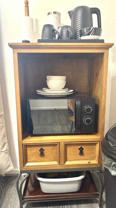 In each room: Microwave, plates, bowls, cutlery, tea, coffee, sugar, biscuits, kettle, mugs, drinking glasses