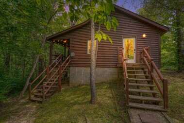 Front door/stairs and stairs to back deck with wooded views