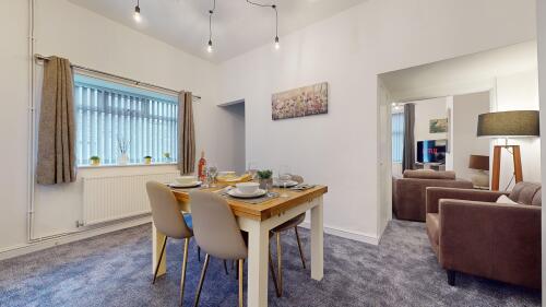 Open plan dining area leads into the living room