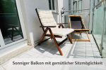 Sunny balcony with cozy seating