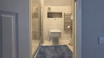 The second-floor bathroom is a beautifully decorated space featuring a modern walk-in shower and heated towel rails – because there's nothing better than wrapping yourself in a warm towel after a shower. Conveniently located for guests staying in the third and fourth bedrooms, it's both stylish and practical.