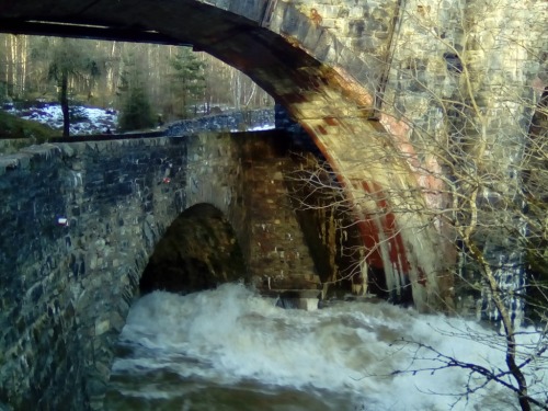 The famous Calvine railway and road bridges with the River Garry in spate, just by the Lodge