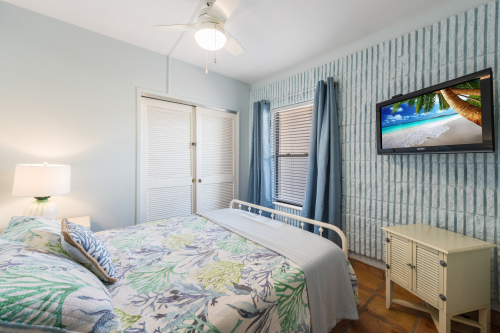 Queen room has blackout curtains and TV with Roku 