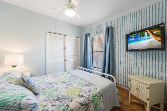 Queen room has blackout curtains and TV with Roku 