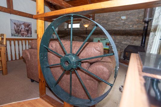 The Original Mill Wheel - The cast iron wheel that gives this cottage its name, preserved and displayed as a stunning architectural feature in the heart of the living space, perfect for guests who love real history and character