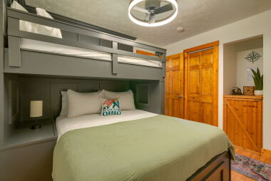 Secondary bedroom with queen and xl twin bunk with ceiling fan