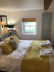 Bedroom 1 with view of garden