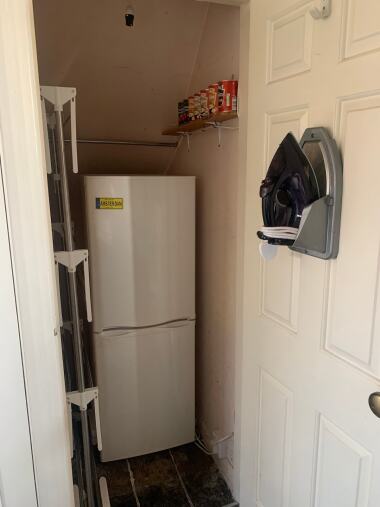 Fridge freezer, iron and clothes hanger
