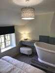 Bedroom 1 with window and bath
