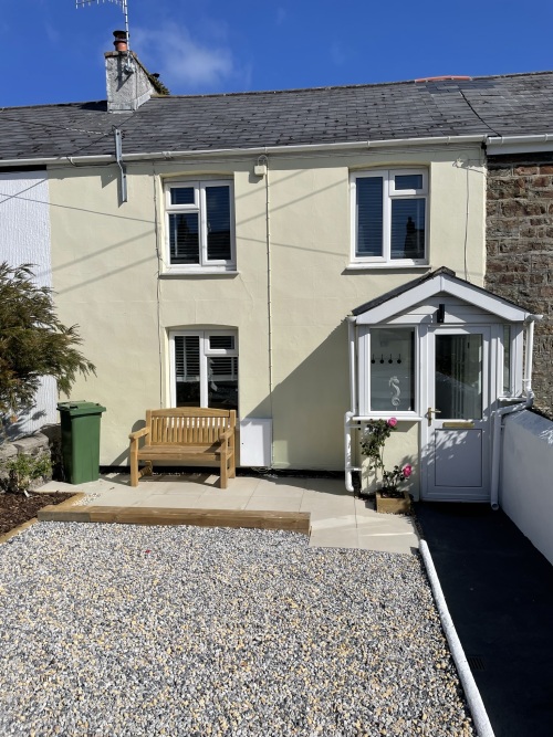 Front entrance and parking space