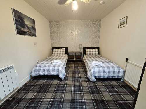 Second bedroom showing coverless duvets washed after every use