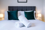 A cosy bedroom featuring a comfortable double bed, perfect for restful nights and relaxing stays.