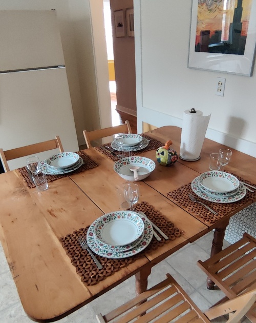 The dining table located in the spacious kitchen.