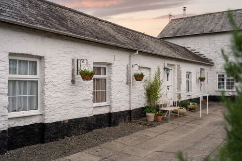 The sun sets over Gardener Cottage