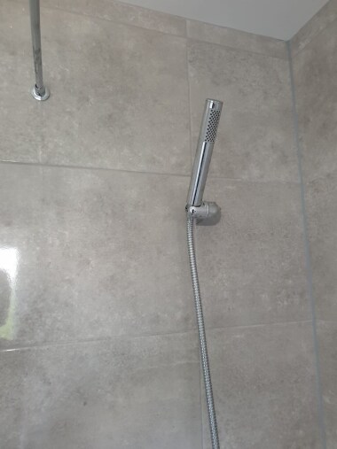 Bathroom showing hand held shower head