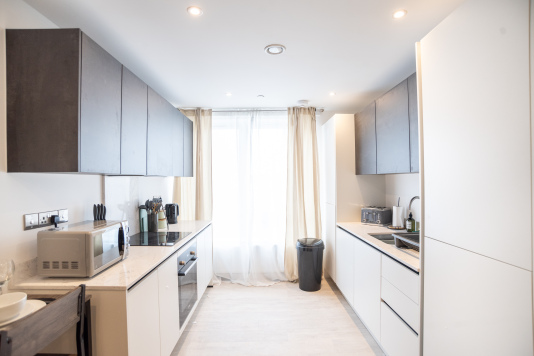 Modern fully equipped kitchen with everything needed for cooking.