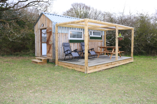 Henhouse with deck, picnic bench and sun loungers