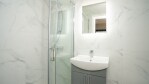 Clean fresh modern ensuite bathroom, with walk in shower. toiletries and towels provided Apt 5