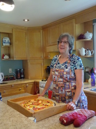 Cathie preparing a breakfast pizza