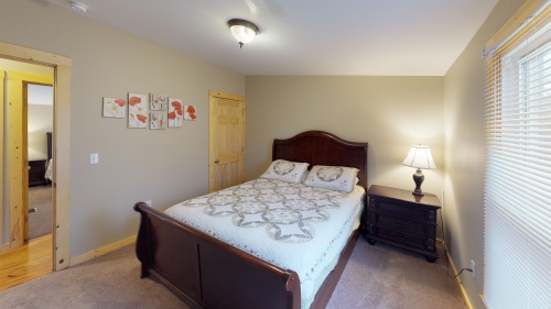 Bedroom 3 comfortably accommodates 2  guests in its Queen sized bed. 