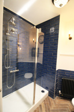 Upstairs Bathroom with shower, toilet and sink