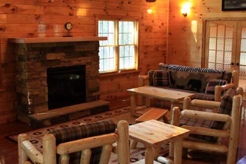 great room with Amish-made furniture, two chairs, end tables, fireplace, 37- inch flat screen tv, DVD player,deer & moose mounts