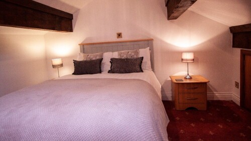 Self Catering Double Bedroom via spiral staircase off lounge area