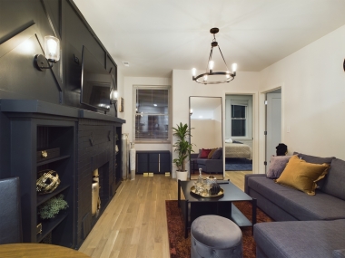 Enjoy intimate moments at the round dining table for two. Perfect for romantic dinners, morning coffee, or catching up with the news. This cozy nook combines modern style with comfort, framed by the elegance of the surrounding jazz-inspired decor.