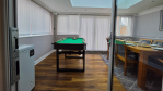 The conservatory is a real showstopper. Accessed through the kitchen, this bright and spacious room features a dining table with seating for 6, a pool table for friendly competition, and a 43" Smart TV for entertainment. Patio doors open directly onto the back garden, creating a seamless indoor-outdoor flow that's perfect for groups and families.