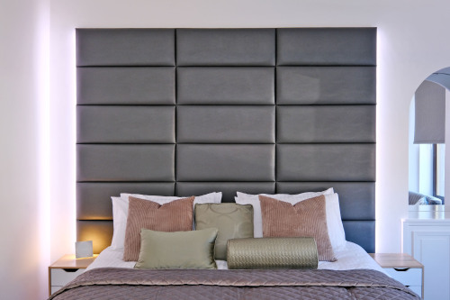 First Floor bedroom with striking and comfortable headboard with integrated reading light.  Bed has integrated tread lighting to safely guide you in night mode to kitchen or bathroom
