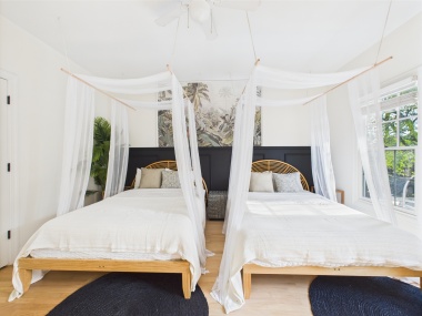 Perfect for friends or family, these double canopy beds blend charm with comfort.