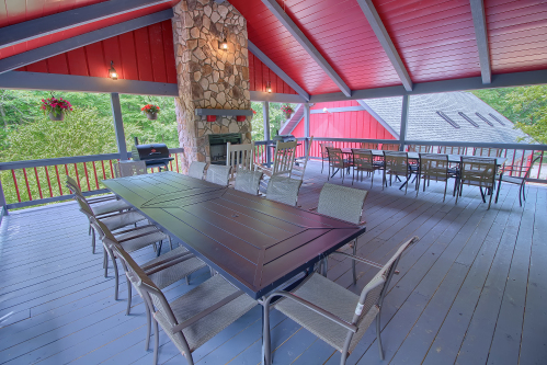 Back Deck, with Wood-Burning Fireplace, with Outdoor Dining Area, looking toward Pool Room, Southern Belle Lodge
