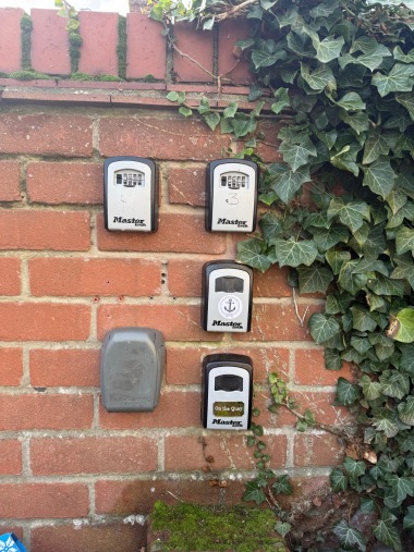 Lock Box on wall by recycling bins