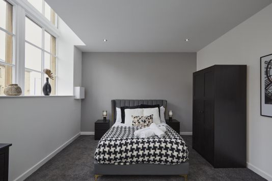 Your private retreat: a stylish double bedroom with a calm, welcoming feel.