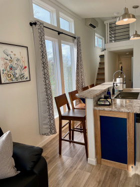 The open kitchen,  in-unit laundry, and loft make the Blackbird the perfect space for a family vacation! 