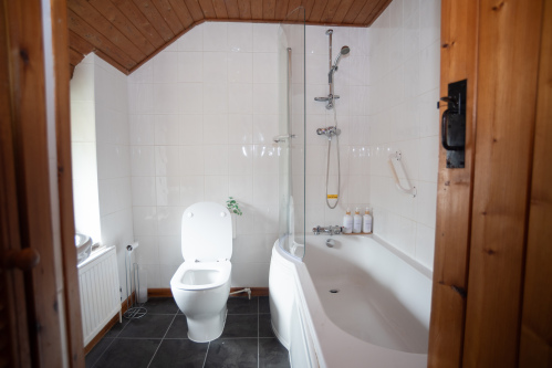 Second Full Bathroom - A second bathroom with bath, overhead shower and complimentary toiletries so the whole group is never kept waiting.