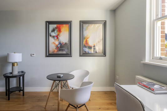 An elegant dining area designed for memorable gatherings, featuring a statement dining table, sophisticated seating, and ambient lighting. This refined space blends style and comfort, perfect for both intimate meals and grand entertaining.