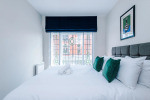 Comfortable bedroom with a king-size zip and link bed that can be separated into two singles upon request.