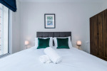 Comfortable bedroom with a king-size zip and link bed that can be separated into two singles upon request.