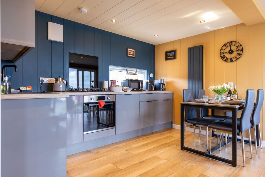 [{'Text': 'Kitchen and dining area', 'CultureCode': 'en-GB'}] glamping cabins and grounds, photo 21 of 32