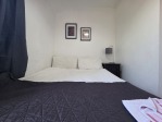 A cosy double bed, a spacious wardrobe, and fresh towels provided – the second bedroom has everything you need for a comfortable stay.