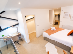 Wake up refreshed in a bright and airy bedroom space.