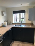 Kitchen area with sink and view of garden