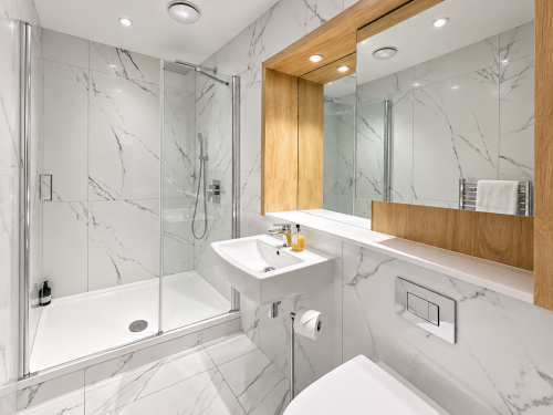 Walk-in shower
Stylish walk-in shower finished with elegant marble-effect tiles, a rainfall shower and polished chrome fittings for a luxurious, hotel-inspired feel.