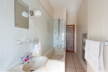 Bathroom with shower over and WC