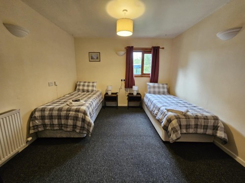 Bedroom 2 with two single beds