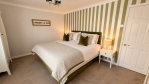 Beautiful master bedroom, the ideal retreat to relax after a day of exploring.